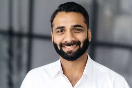 Home 177449938 close up portrait of a successful intelligent bearded indian businessman manager or it specialist